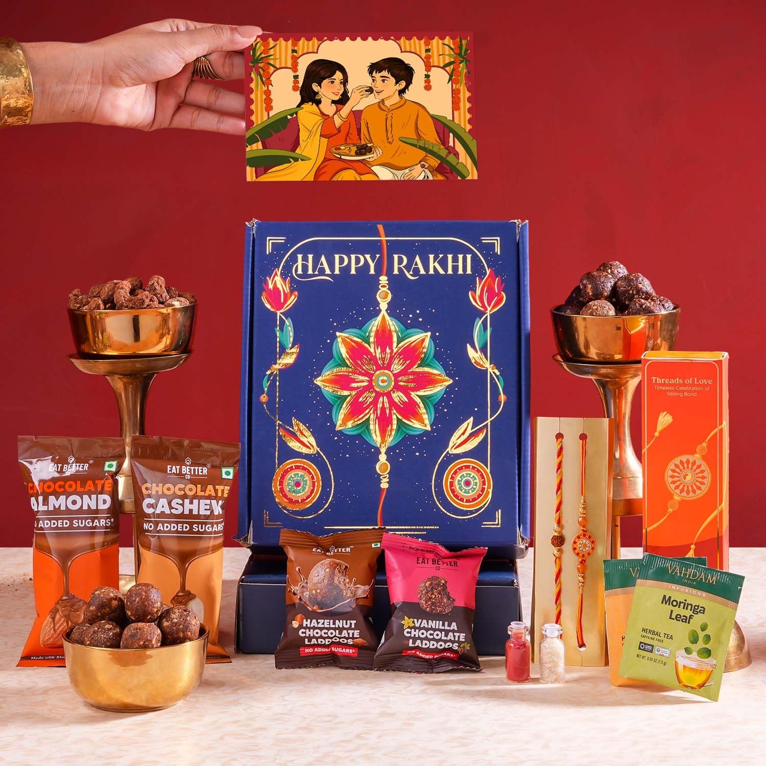 Bandhan - 10-Item Rakhi Gift Hamper for brother with set of 2 Premium Rakhis, Chocolate Coated Cashews & Almonds, Hazelnut Dry-Fruit Laddoos | Rakhi for Brother with Gift Combo Set by Eat Better C