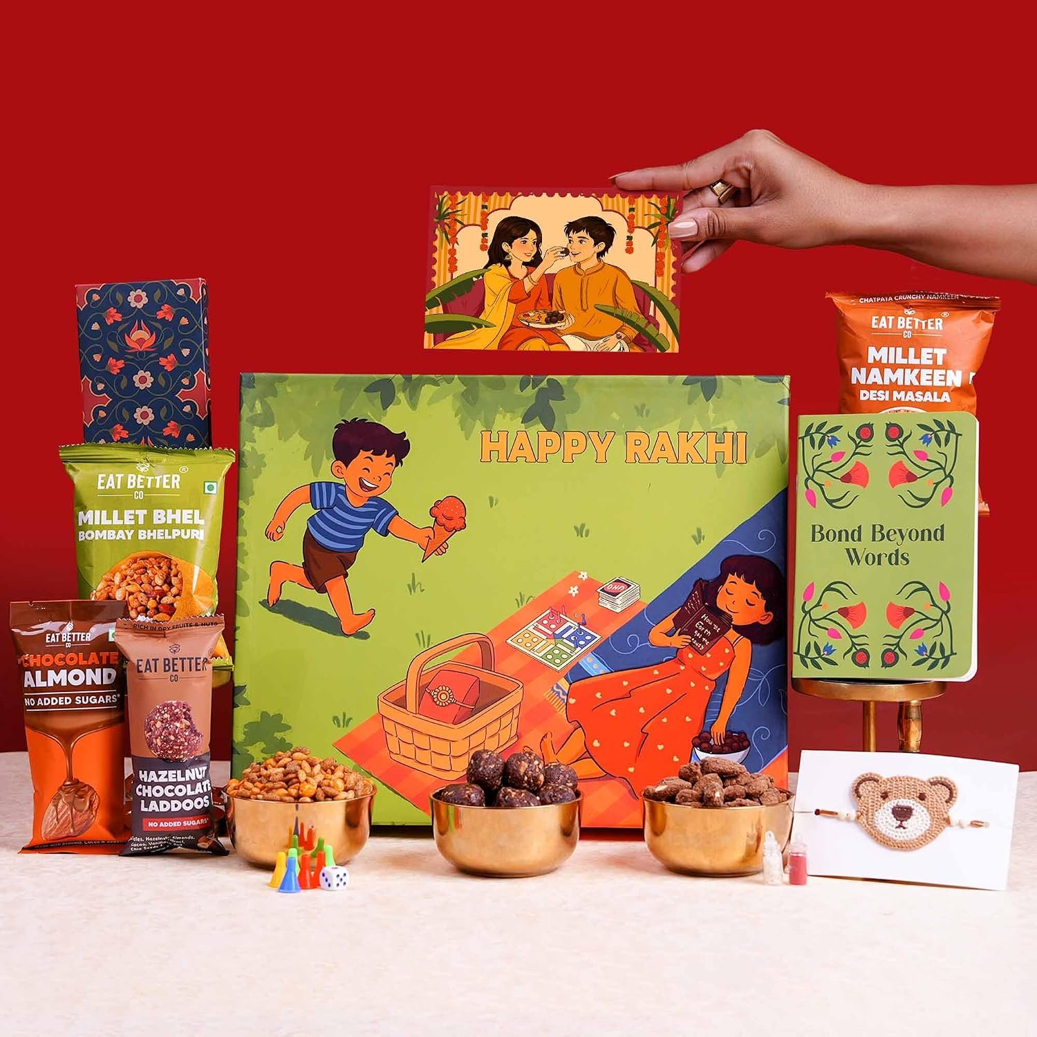 9-Item Rakhi for Kids | Gift Hamper with Teddy-Bear Rakhi, Ludo Game, Chocolate Dry-Fruit Laddoos, Millet Snacks, Diary & more Healthy Kids Gift with Kids Rakhi & Roli-Chawal by Eat Better Co